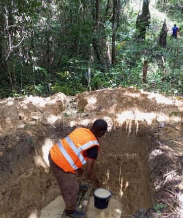 Trial pit excavation and dewatering before soil sampling on the Gehwee Junction – Gbedin Falls access road, Nimba County, Liberia