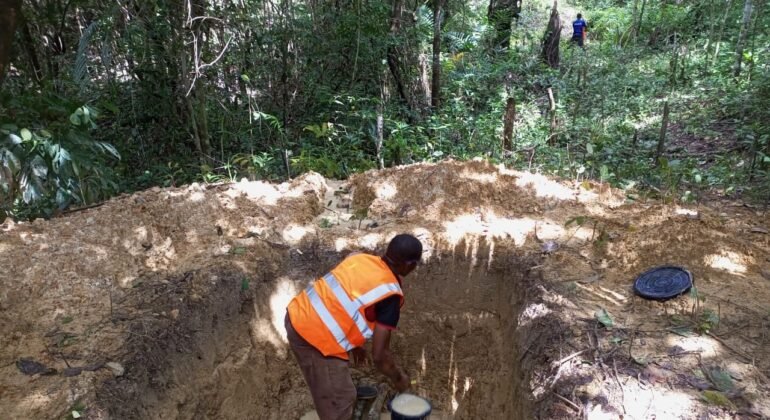 Trial pit excavation and dewatering before soil sampling on the Gehwee Junction – Gbedin Falls access road, Nimba County, Liberia